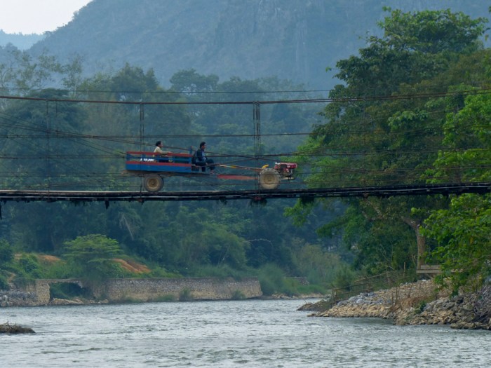 Tractor crossing bridge