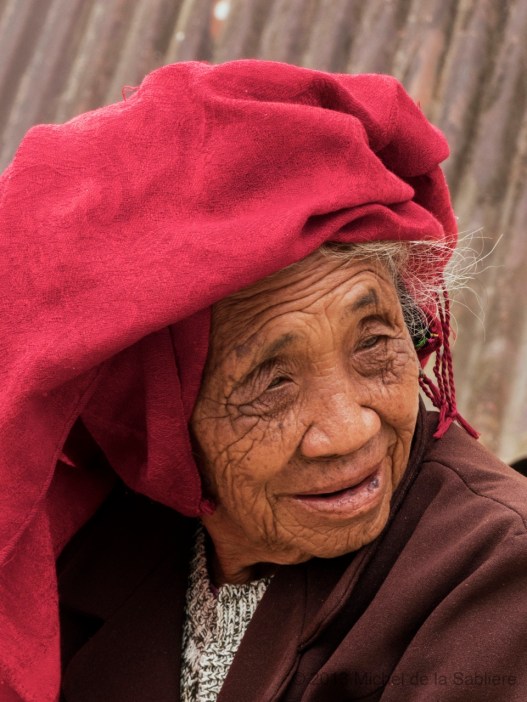 Old woman in red scarf