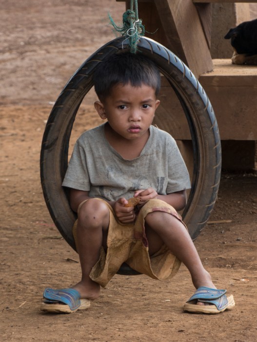 Katu child on a swing