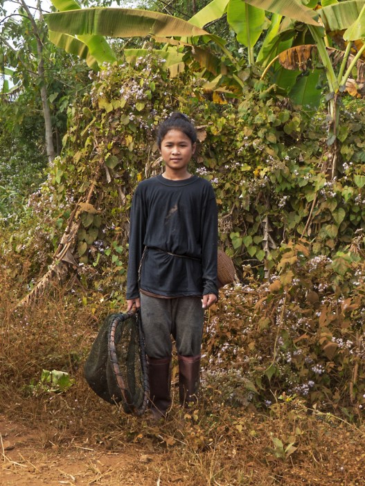 Katu girl fishing near the village