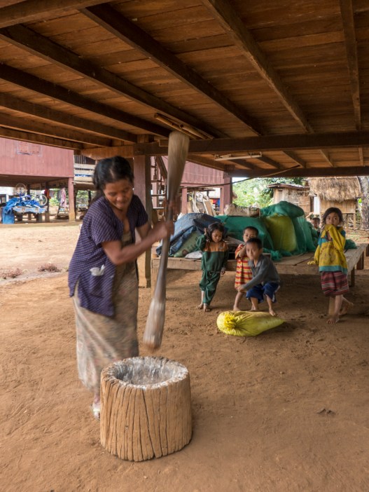 Woman grinding Manioc