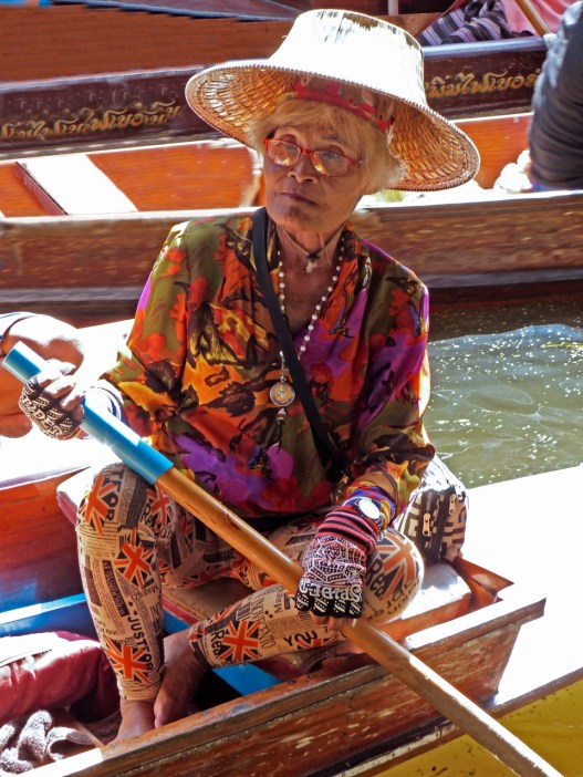 A woman at the floating market in Thailand - she is cool!