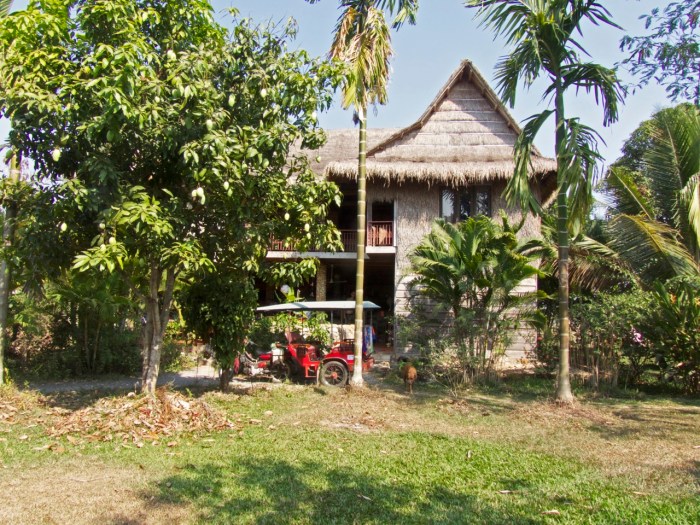 The main house with waiting tuk tuk driver