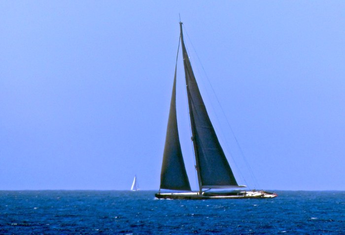 A very large sailboat on it's way out to sea